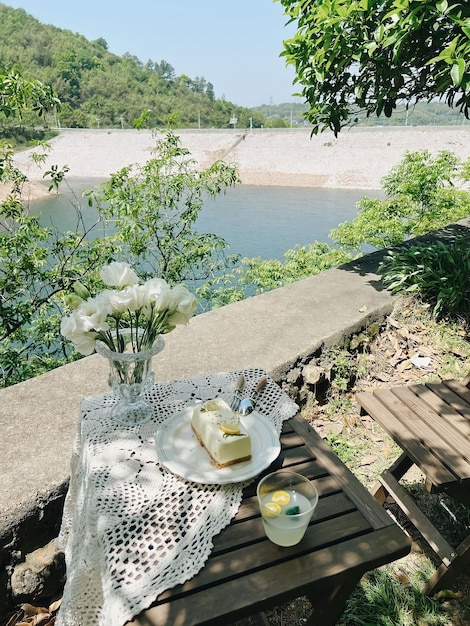 A table with a white cloth on it and a glass of wine on it.