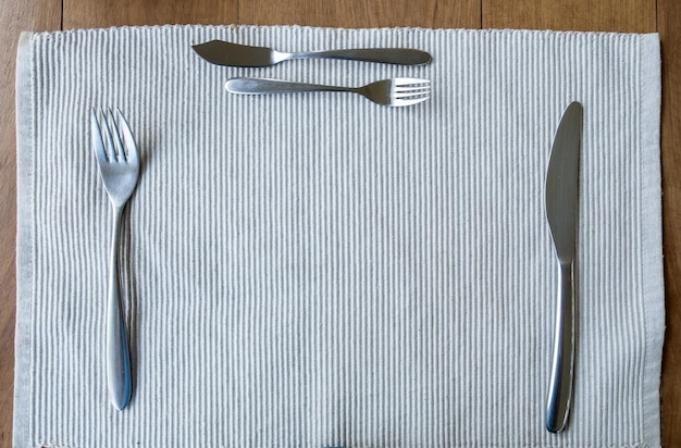 Tablecloth empty fork and knife on table