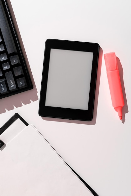 Tablet Screen With Important Ideas On It And Note Sticked On It On Desk With Notebook And Marker Cellphone With Crutial Informations And Memo Attached To It