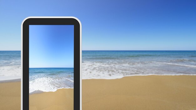 Tablet smartphone taking picture of sandy seashore