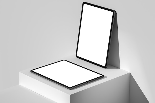 A tablet and a tablet are on a white pedestal.