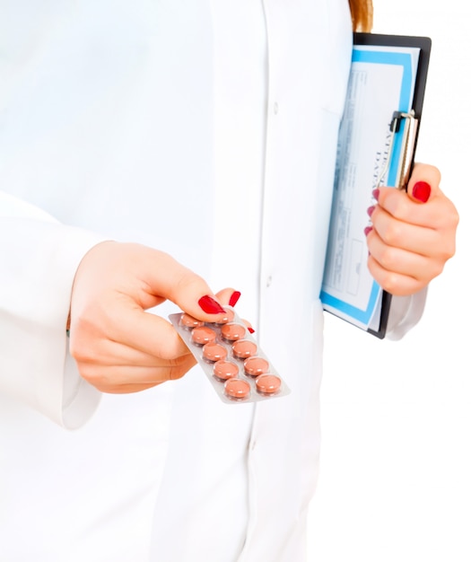 Tablets and pills in a female doctor's hand