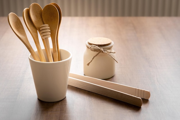 Tableware from natural materials bamboo wooden spoons in cup zero waste eco friendly concept free space for text