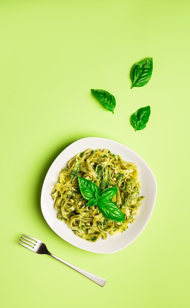 Tagliatelle pasta with pesto sauce, basil and pine nuts