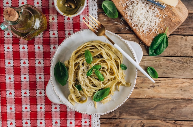 Tagliatelle pasta with pesto sauce and basil