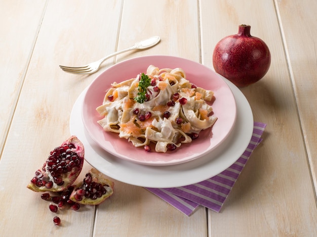 Tagliatelle with salmon pomegranate and cream sauce