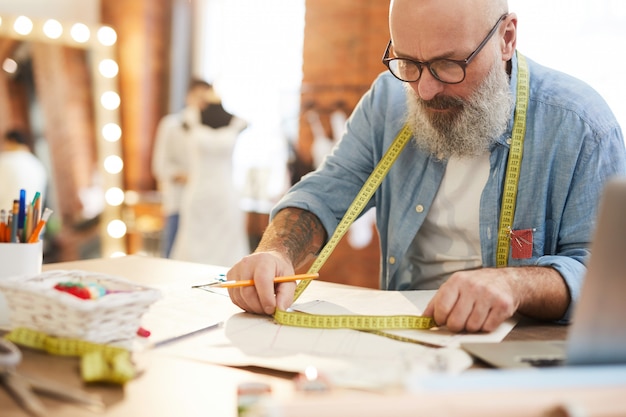 Tailor with measuring tape