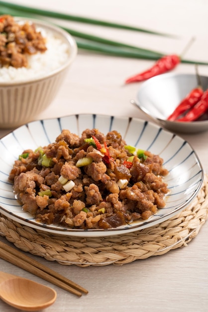 Taiwanese fried minced pork with pickled cucumber on rice named GUA ZI ROU FAN