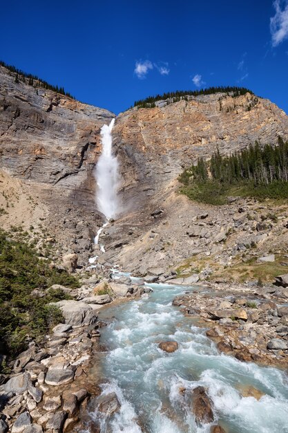 Takakkaw Falls in Yoho National Park during a vibrant sunny summer day