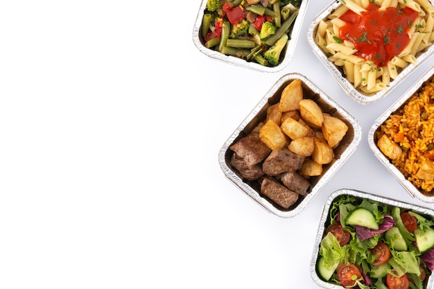 Take away healthy food in foil boxes isolated