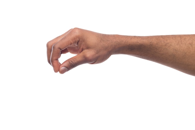 Taking. Black male hand grab some items on white isolated background, cutout, copy space