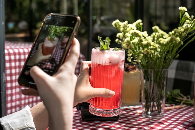 To taking cold drink photo with phone