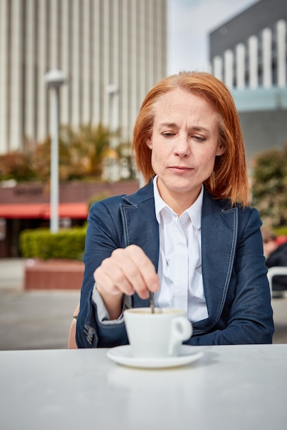 Taking a moment to recharge a successful middleaged businesswoman enjoys a peaceful coffee break