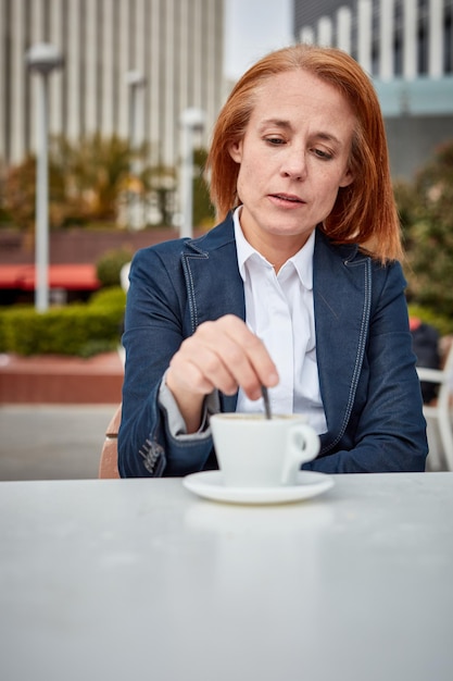 Taking a moment to recharge a successful middleaged businesswoman enjoys a peaceful coffee break