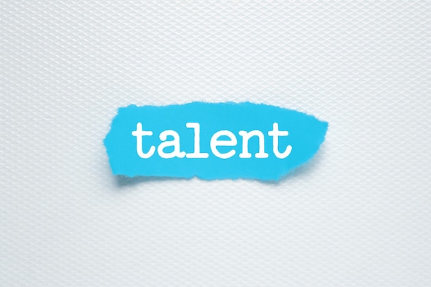 Talent text on white background blue torn paper