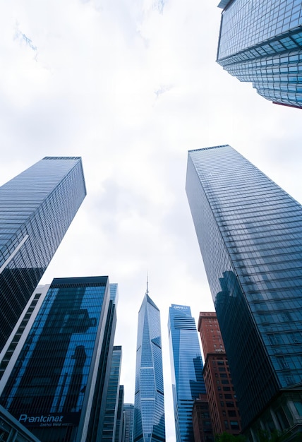 a tall building with a plane flying over it