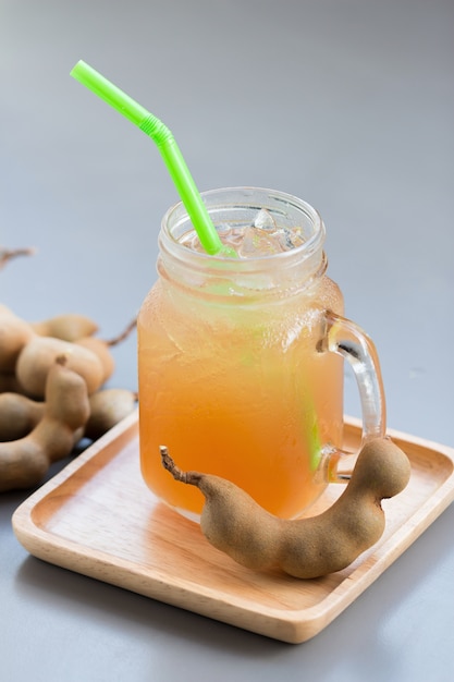 tamarind juice with sugar on gray table