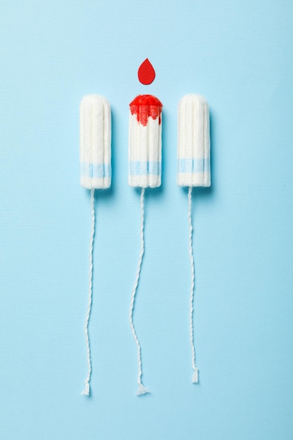 Tampons for menstrual days on a blue background