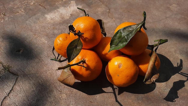 Tangerines citrus fruit on exposed cement background 01