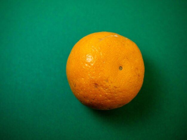 Tangerines on a green background Whole juicy fruits