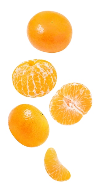 Tangerines whole and peeled slices falling hanging flying soaring isolated on white background with clipping pathxA