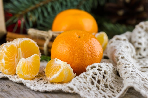 Tangerines with cinnamon sticks and Christmas tree branches