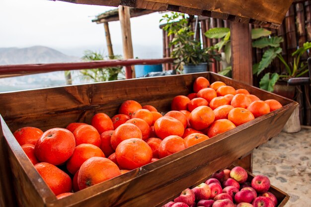 Tangerines in a wooden basket in a market