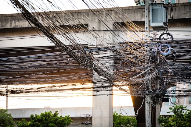 Tangle of Electrical cables and Communication wires on electric pole