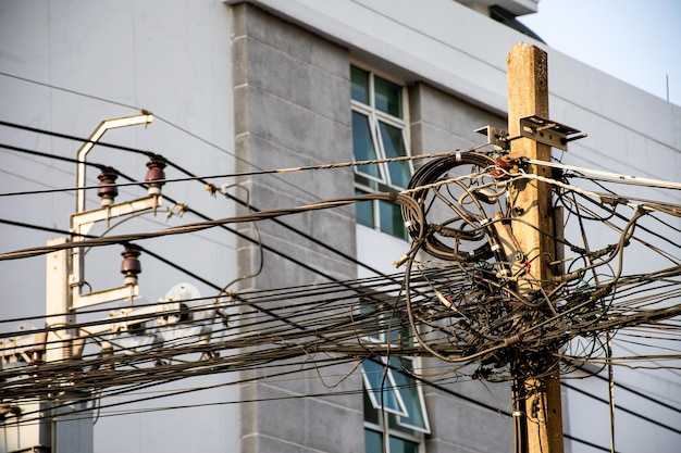 Tangle of Electrical cables and Communication wires on electric pole