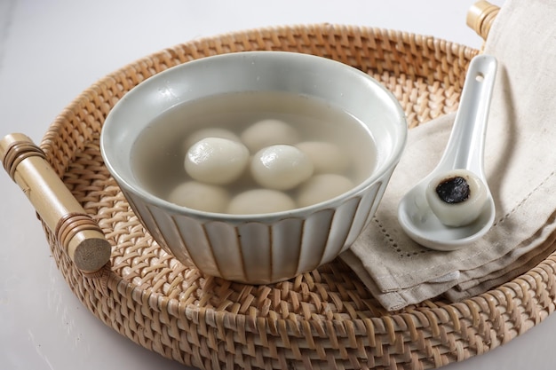 Tangyuan, glutinous rice dumpling fill with black sesame seeds paste.