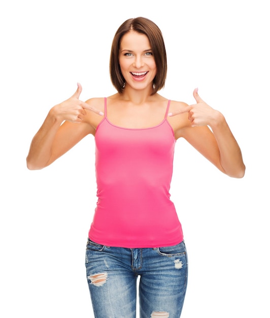 tank top design concept - smiling woman in blank pink tank top