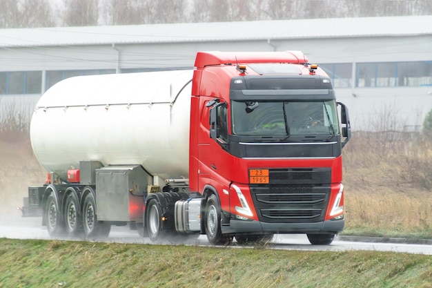 A Tank Truck Carrying LPG Gas on a Snowy Highway A Transportation Service for Dangerous Goods