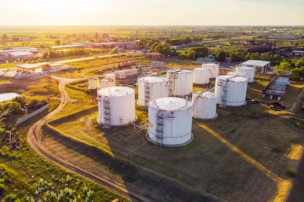 Tanks with petroleum products are among the fields near the village. The view from the top. aerial view. refuelling