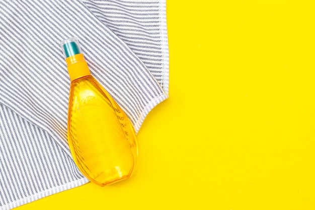 Tanning oil on a yellow background