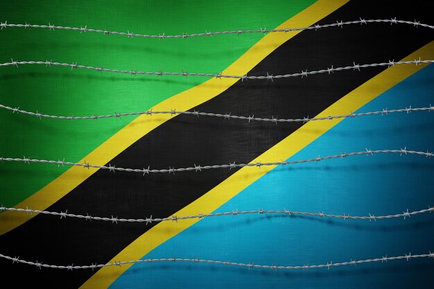 Photo tanzania flag and barbed wire 3d illustration