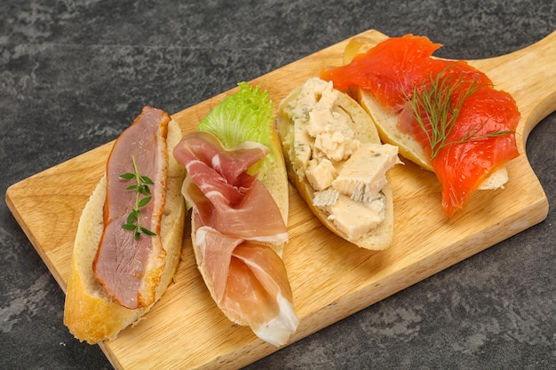 Tapas bruschetta with prosciutto salmon duck and gorgonzola