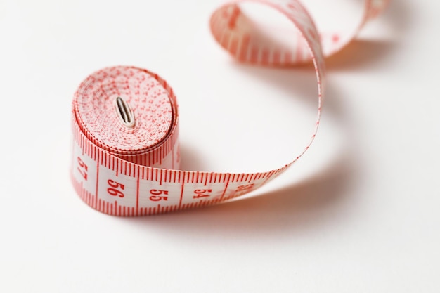 Tape Measure Rolled Isolated on White with Copyspace