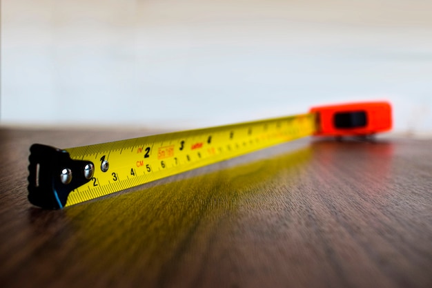 tape measure on wooden floor for composition