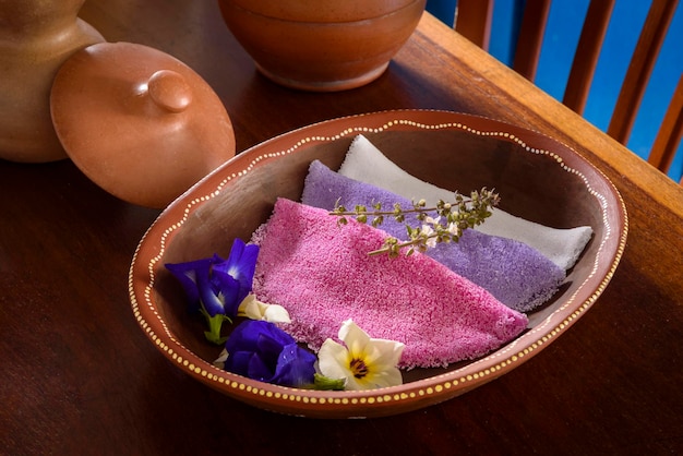 Tapioca Colorful Brazilian tapiocas served in clay bowls with wildflowers for breakfast