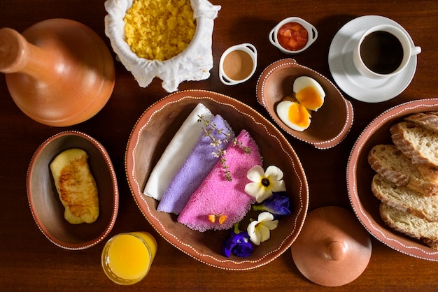 Tapioca Colorful Brazilian tapiocas served in clay bowls with wildflowers for breakfast