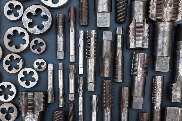 Taps and dies for threading metal Tools for cutting external and internal threads closeup