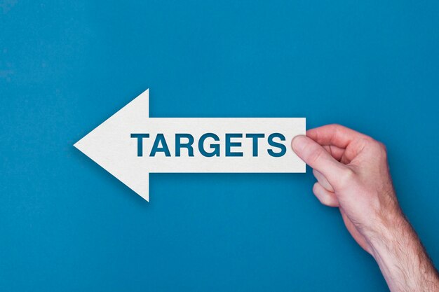 Targets arrow direction held on a blue background