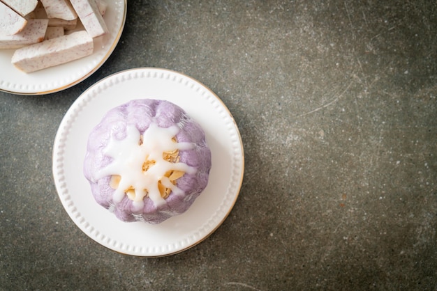 taro bun with white sugar cream and nut on top