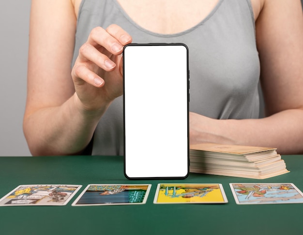 Tarot card reading with mobile phone screen mockup Taro reader with modern application on smartphone