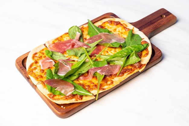 Tart flambe parma ham and rocket pizza