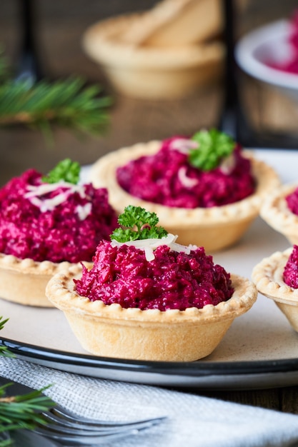 Tartlets with beetroot and cheese on a plate