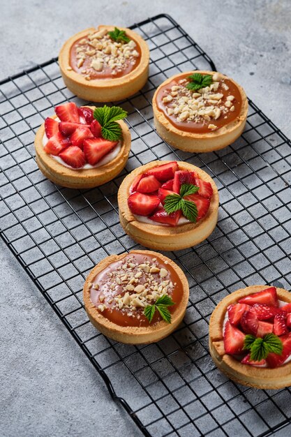 Tartlets with caramel, berries and cream cheese. A beautiful and delicious dessert.