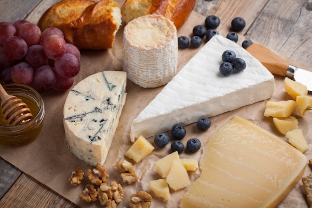 Tasting cheese dish on a wooden board.