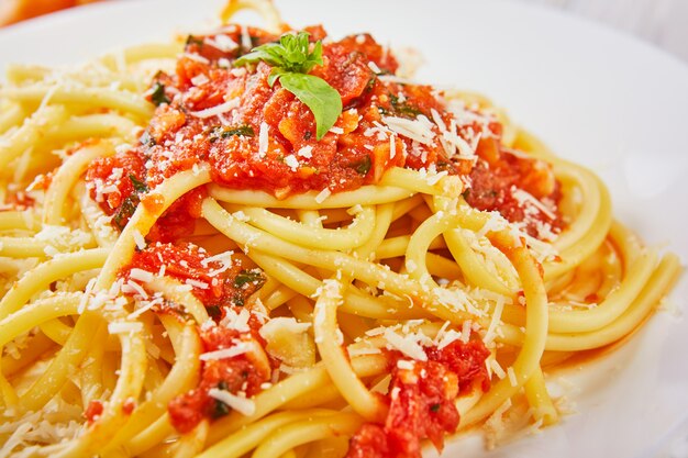 Tasty appetizing classic Italian spaghetti pasta with tomato sauce