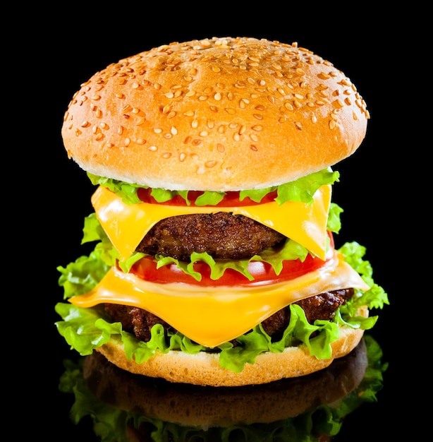 Tasty and appetizing hamburger on a darkly background